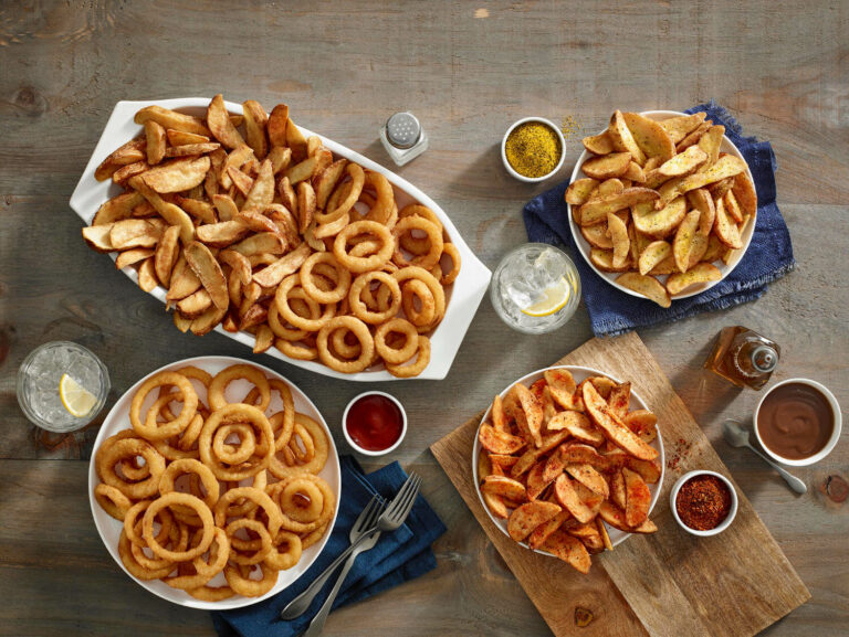 61688c6122a9f012f24f39f8_Fries_on_Table_compressed